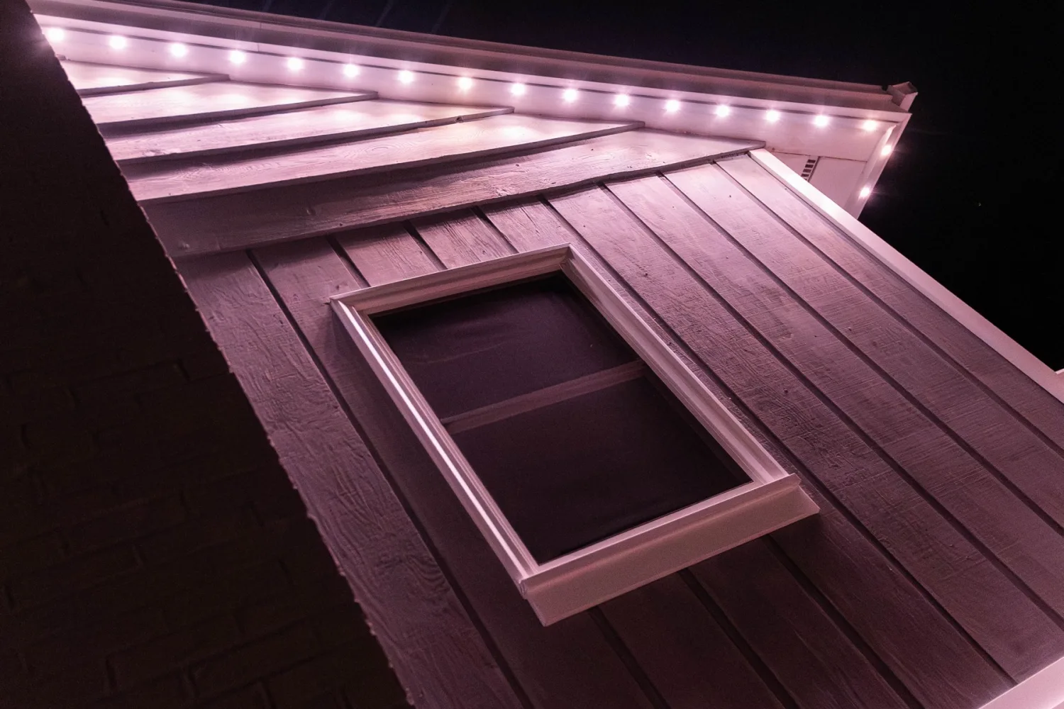Close view of Gemstone permanent lights along a roofline