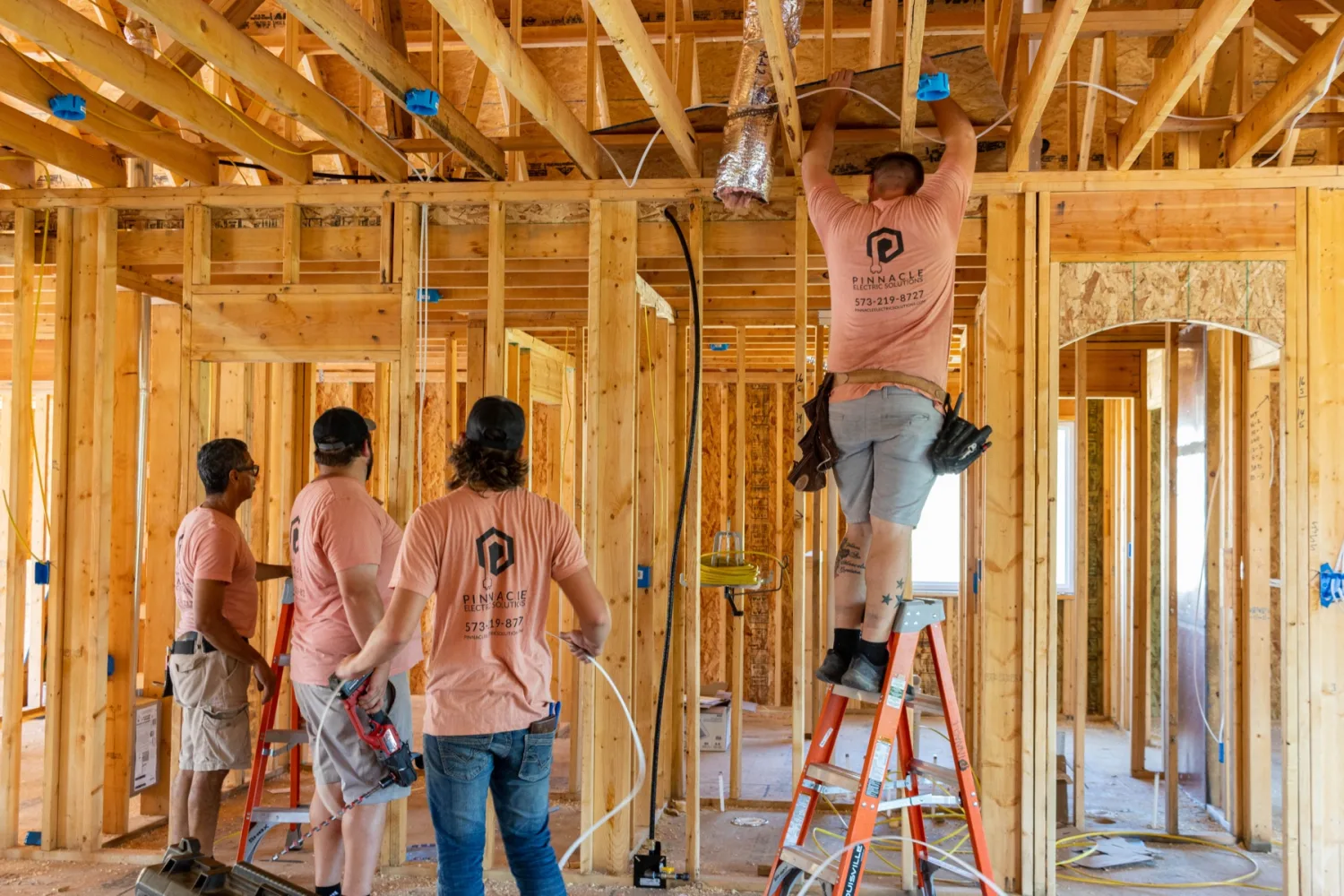 Pinnacle Electric crew wiring a home under construction