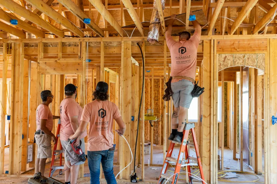 Pinnacle Electric crew wiring a home under construction